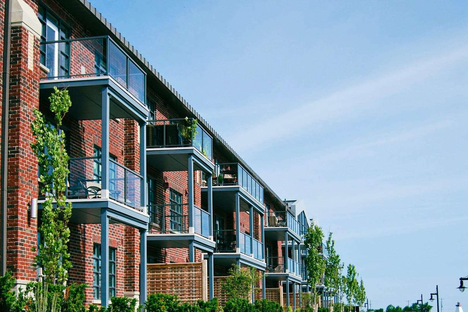 Brick apartment block with rows of balconies